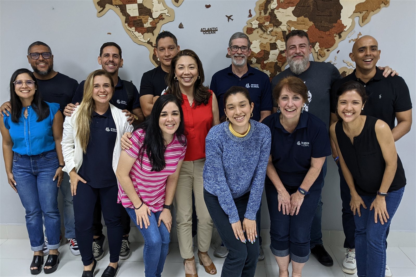 Missio Global group in front of a world map